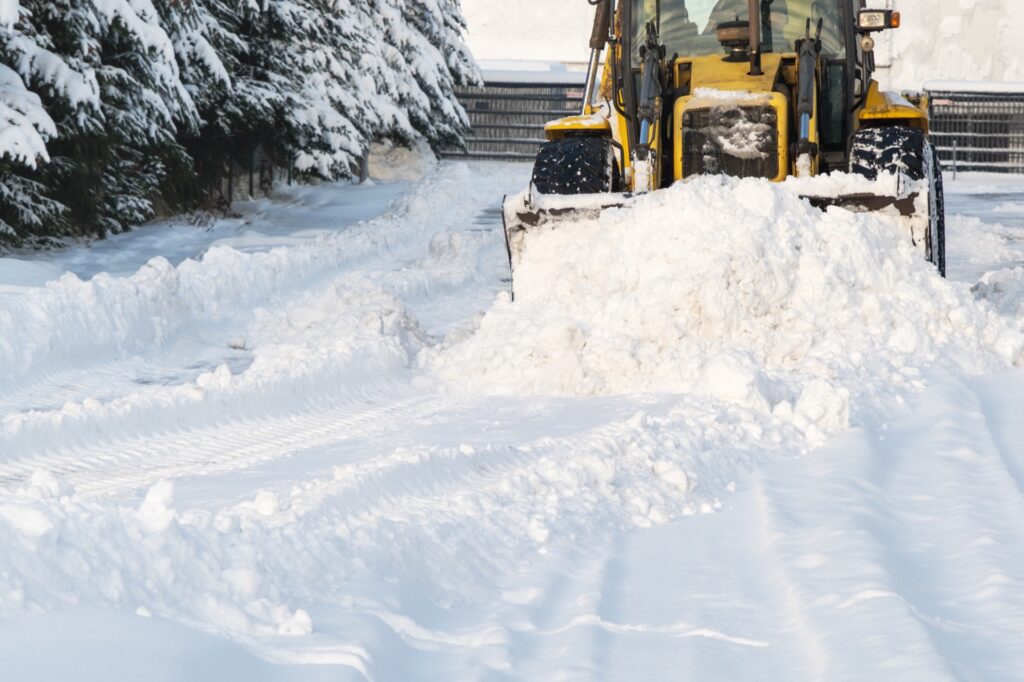 Heavy equipment performing snow removal